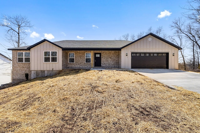 1186 Emory Creek Blvd, Branson, MO 65616 - view of front of home featuring an attached garage, concrete driveway, board and batten siding, and a shingled roof