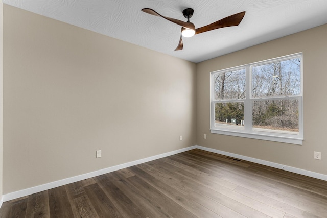 1186 Emory Creek Blvd, Branson, MO 65616 - empty room with a ceiling fan, baseboards, and dark wood-style floors