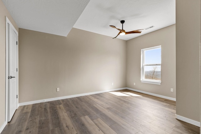 1186 Emory Creek Blvd, Branson, MO 65616 - empty room with a ceiling fan, wood finished floors, and baseboards