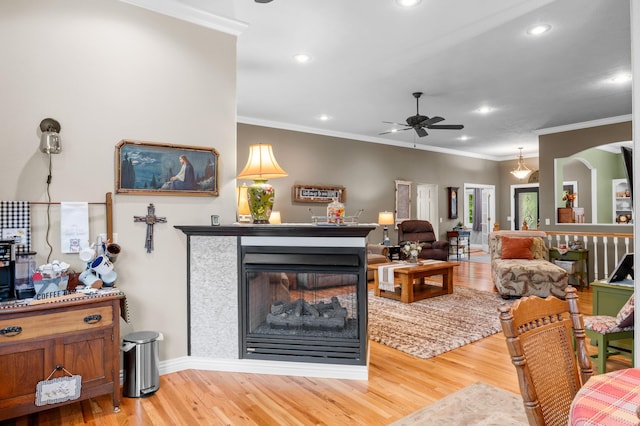 4266 S 94th Rd, Bolivar, MO 65613 - living area with ceiling fan, light wood-style flooring, crown molding, arched walkways, and recessed lighting