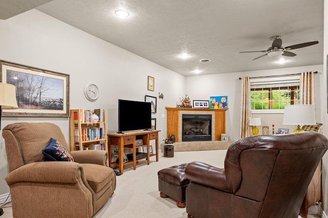 4266 S 94th Rd, Bolivar, MO 65613 - living area featuring light carpet, ceiling fan, a fireplace, recessed lighting, and a textured ceiling
