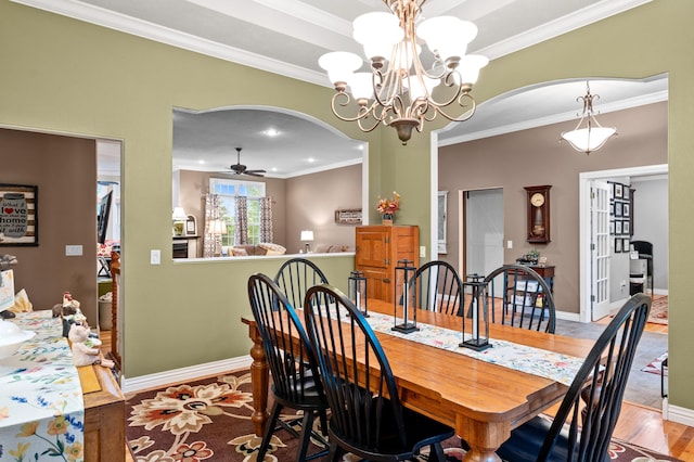 4266 S 94th Rd, Bolivar, MO 65613 - dining room featuring arched walkways, ceiling fan, ornamental molding, wood finished floors, and a chandelier