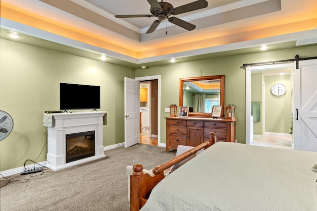 4266 S 94th Rd, Bolivar, MO 65613 - bedroom featuring a barn door, baseboards, light carpet, a glass covered fireplace, and ornamental molding