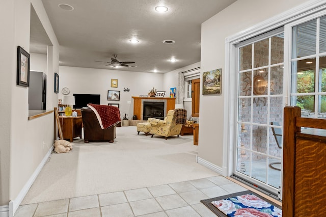 4266 S 94th Rd, Bolivar, MO 65613 - carpeted living room with a ceiling fan, baseboards, tile patterned flooring, a fireplace, and recessed lighting