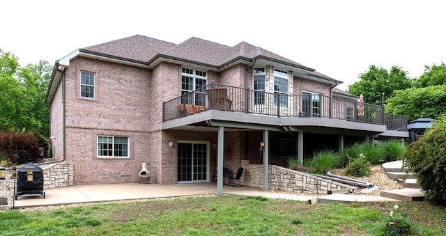 4266 S 94th Rd, Bolivar, MO 65613 - back of house with brick siding, a patio, a deck, and a lawn