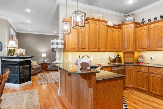 4266 S 94th Rd, Bolivar, MO 65613 - kitchen featuring dark stone countertops, light wood-style floors, pendant lighting, recessed lighting, and brown cabinetry