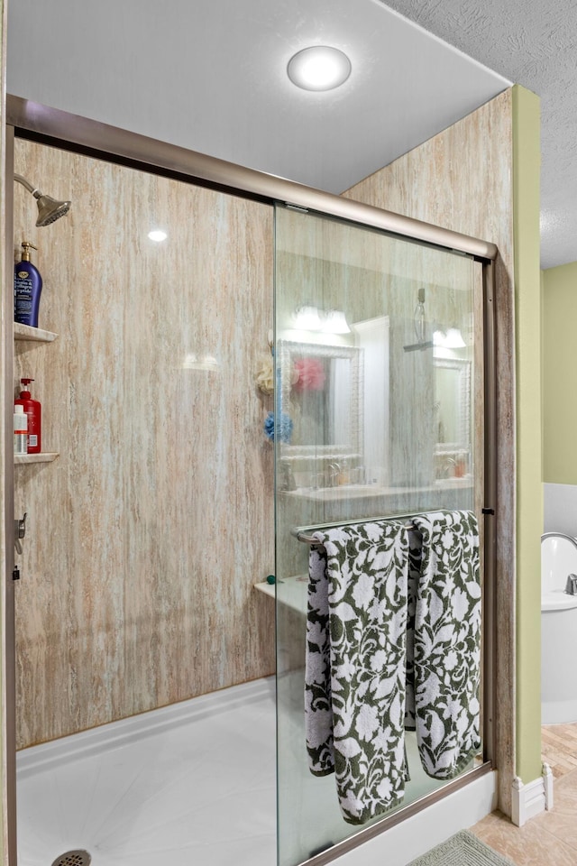 4266 S 94th Rd, Bolivar, MO 65613 - full bath with a stall shower, a textured ceiling, and tile patterned flooring