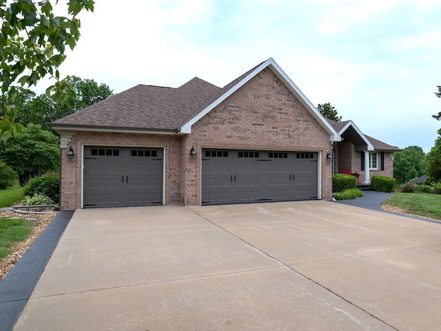 4266 S 94th Rd, Bolivar, MO 65613 - ranch-style house featuring brick siding, concrete driveway, an attached garage, and roof with shingles