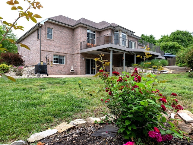 4266 S 94th Rd, Bolivar, MO 65613 - rear view of property featuring brick siding, a balcony, a lawn, and a patio