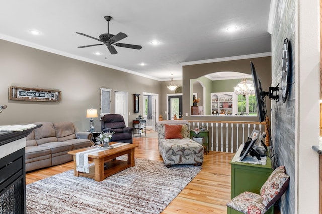 4266 S 94th Rd, Bolivar, MO 65613 - living room featuring wood finished floors, ornamental molding, ceiling fan, recessed lighting, and arched walkways