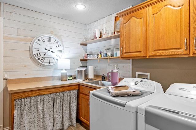 4266 S 94th Rd, Bolivar, MO 65613 - laundry area featuring washer and clothes dryer, cabinet space, wooden walls, and a textured ceiling