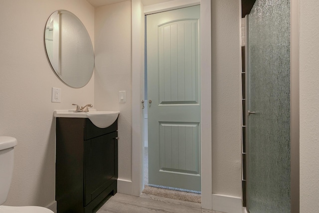 439 Union Chapel Rd, Fordland, MO 65652 - bathroom featuring toilet, vanity, and wood finished floors
