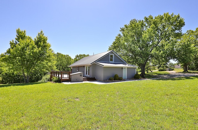 439 Union Chapel Rd, Fordland, MO 65652 - view of home's exterior featuring a yard, a deck, and metal roof