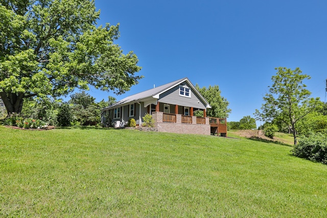 439 Union Chapel Rd, Fordland, MO 65652 - rear view of house featuring a lawn and a porch
