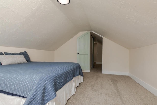 439 Union Chapel Rd, Fordland, MO 65652 - bedroom featuring light carpet, baseboards, vaulted ceiling, and a textured ceiling