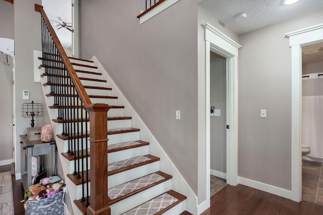5116 S 165th Rd, Bolivar, MO 65613 - staircase featuring a ceiling fan, wood finished floors, baseboards, and a textured ceiling