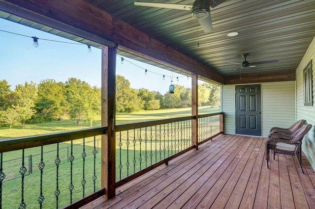 5116 S 165th Rd, Bolivar, MO 65613 - wooden deck with a ceiling fan, a lawn, and view of scattered trees