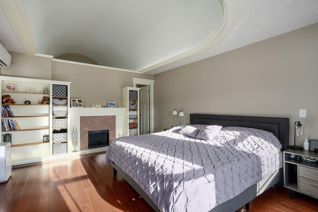5116 S 165th Rd, Bolivar, MO 65613 - bedroom featuring dark wood-type flooring and a tiled fireplace