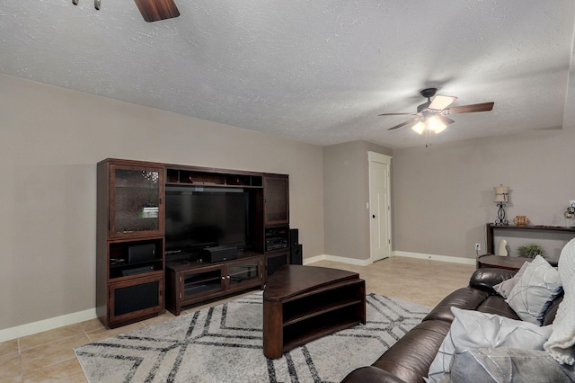 5116 S 165th Rd, Bolivar, MO 65613 - living area with a ceiling fan, baseboards, light tile patterned floors, and a textured ceiling