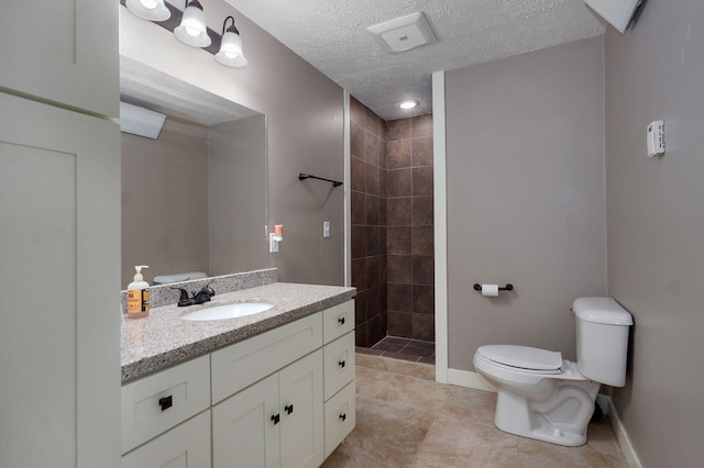 5116 S 165th Rd, Bolivar, MO 65613 - full bath featuring toilet, vanity, a tile shower, baseboards, and tile patterned flooring