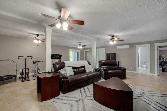 5116 S 165th Rd, Bolivar, MO 65613 - living room featuring a ceiling fan, light tile patterned flooring, a wall mounted AC, ornate columns, and a textured ceiling