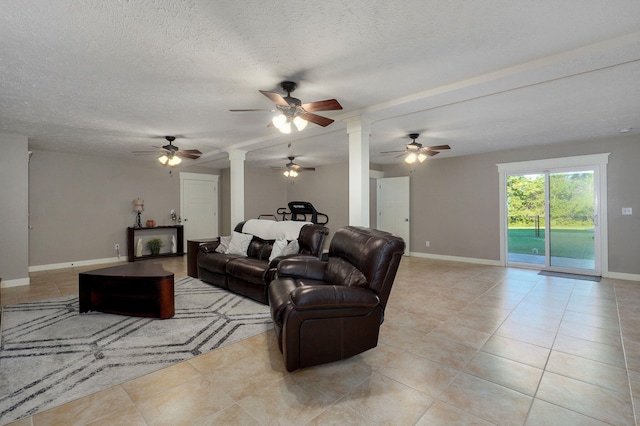 5116 S 165th Rd, Bolivar, MO 65613 - living room featuring decorative columns, ceiling fan, light tile patterned floors, baseboards, and a textured ceiling