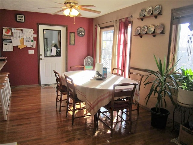 32880 Normal Dr, Eldridge, MO 65463 - dining area with wood finished floors, ceiling fan, and baseboards