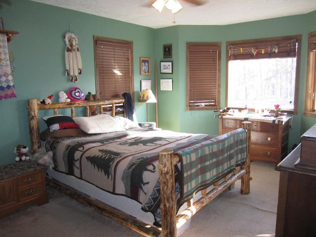 32880 Normal Dr, Eldridge, MO 65463 - carpeted bedroom with a ceiling fan