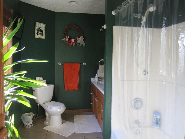 32880 Normal Dr, Eldridge, MO 65463 - full bathroom with tile patterned flooring, toilet, vanity, shower / tub combo with curtain, and baseboards
