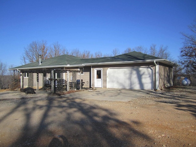 32880 Normal Dr, Eldridge, MO 65463 - view of side of home with driveway, a garage, and stairs
