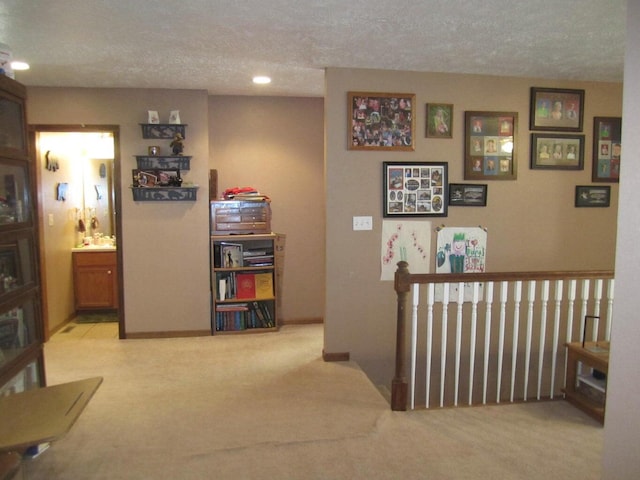 32880 Normal Dr, Eldridge, MO 65463 - hall featuring carpet, a textured ceiling, an upstairs landing, and recessed lighting