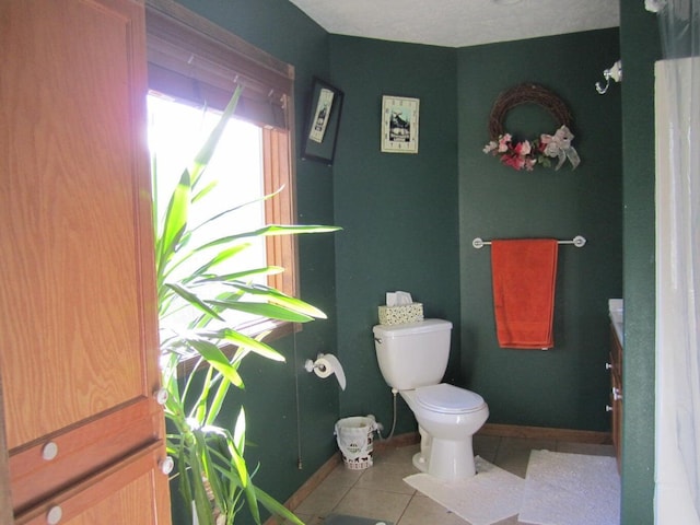 32880 Normal Dr, Eldridge, MO 65463 - bathroom featuring toilet, tile patterned floors, vanity, and baseboards