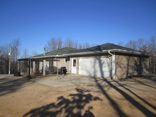 32880 Normal Dr, Eldridge, MO 65463 - view of side of home featuring an attached garage and driveway