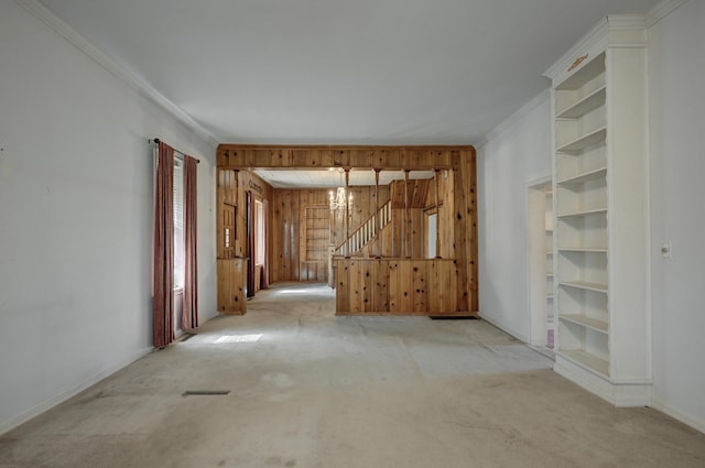 17381 Imperial Rd, Carthage, MO 64836 - unfurnished room with carpet flooring, ornamental molding, baseboards, stairway, and wooden walls