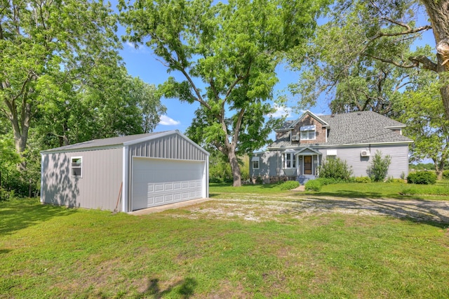 17381 Imperial Rd, Carthage, MO 64836 - view of green lawn with a detached garage and an outbuilding