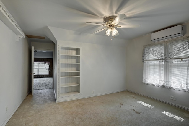 17381 Imperial Rd, Carthage, MO 64836 - carpeted spare room featuring an AC wall unit, a ceiling fan, and baseboards