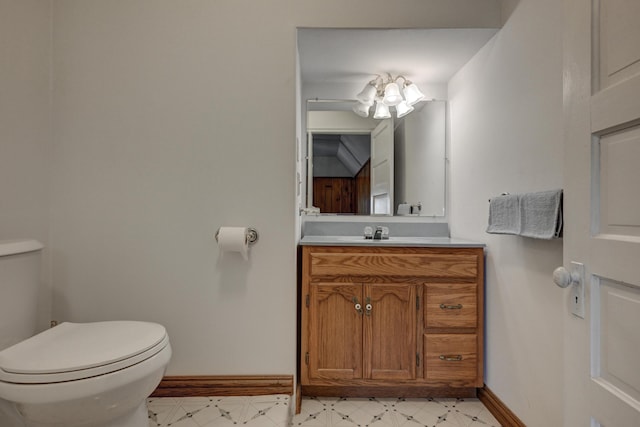 17381 Imperial Rd, Carthage, MO 64836 - bathroom featuring baseboards, toilet, and vanity