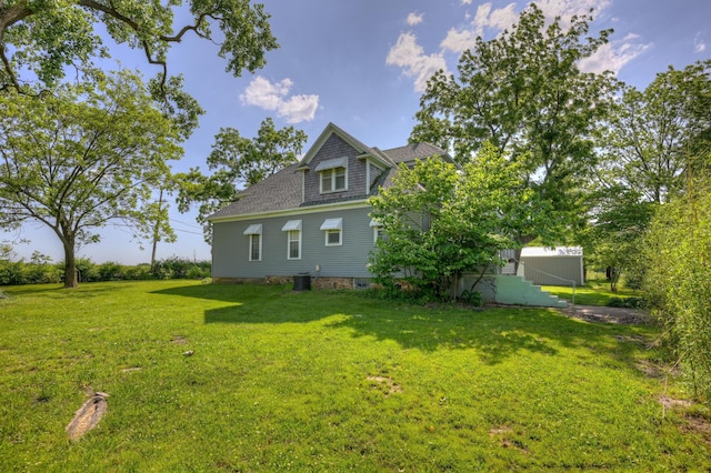 17381 Imperial Rd, Carthage, MO 64836 - view of home's exterior with a lawn, central air condition unit, and a shingled roof