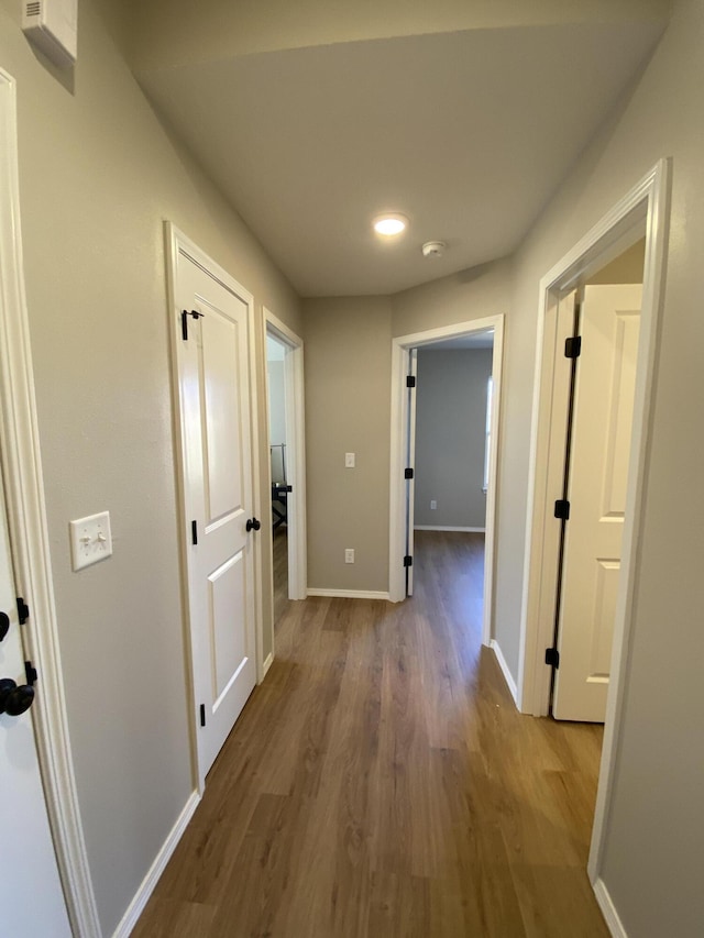 1221 Charlene Dr, Bolivar, MO 65613 - hall featuring wood finished floors and baseboards