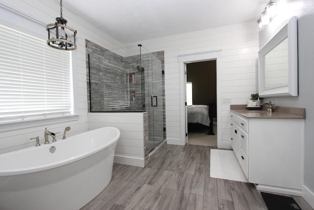 2362 Hazelwood Rd, Seymour, MO 65746 - full bath with vanity, a freestanding tub, wood finished floors, and a shower stall