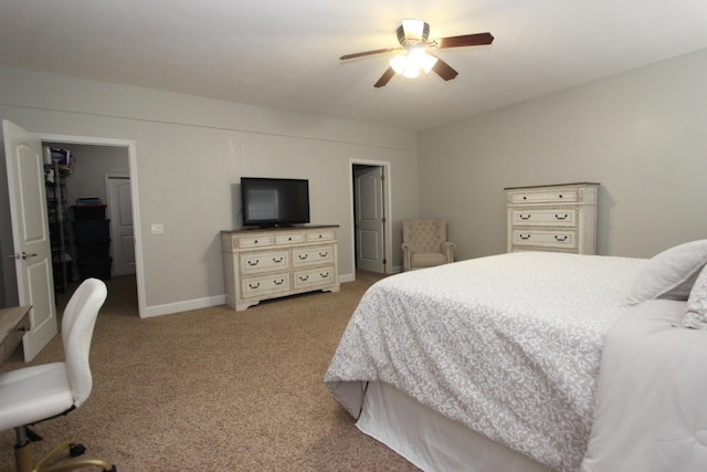 2362 Hazelwood Rd, Seymour, MO 65746 - carpeted bedroom with a ceiling fan and baseboards