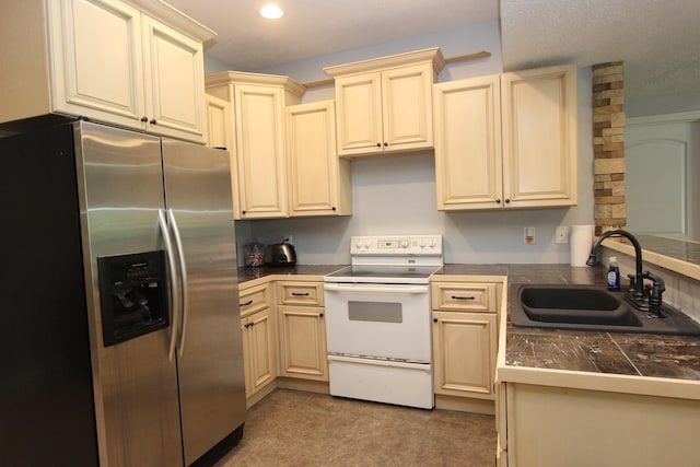 2362 Hazelwood Rd, Seymour, MO 65746 - kitchen featuring stainless steel refrigerator with ice dispenser, white range with electric cooktop, a sink, cream cabinetry, and recessed lighting