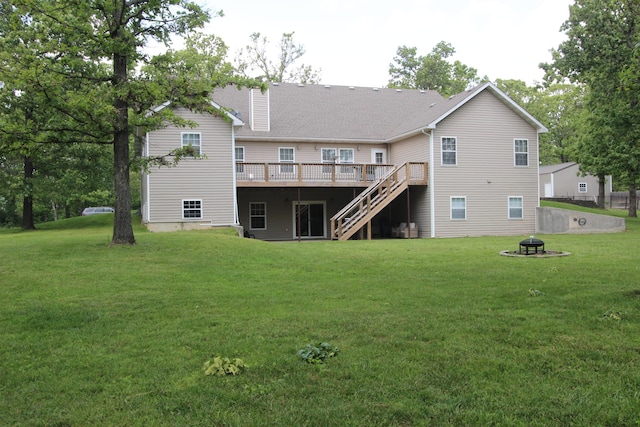 2362 Hazelwood Rd, Seymour, MO 65746 - back of house with a fire pit, stairway, a wooden deck, a yard, and a chimney