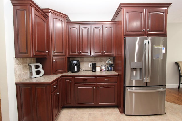 2362 Hazelwood Rd, Seymour, MO 65746 - kitchen featuring stainless steel fridge, backsplash, and dark brown cabinets