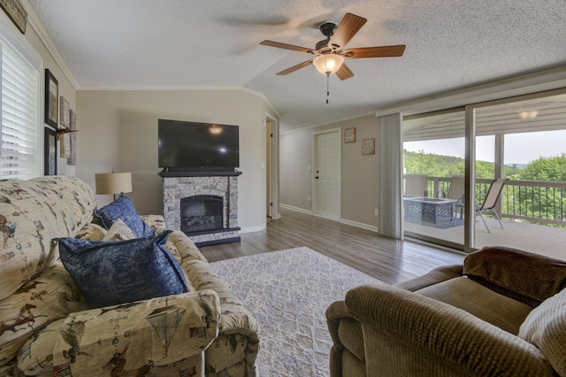 269 Moore Ln, Blue Eye, MO 65611 - living area with ornamental molding, a ceiling fan, wood finished floors, baseboards, and a textured ceiling
