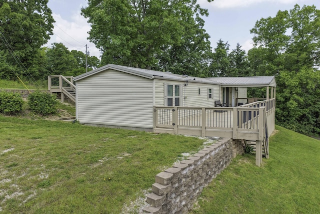 269 Moore Ln, Blue Eye, MO 65611 - rear view of house featuring a lawn and a wooden deck