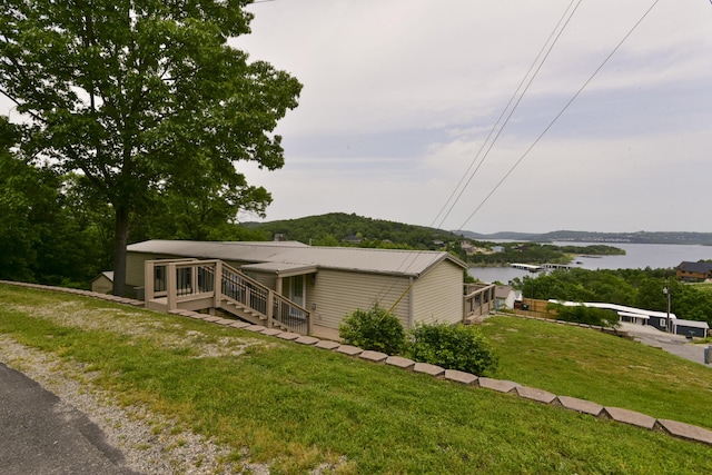 269 Moore Ln, Blue Eye, MO 65611 - view of front of house featuring a water view and a front lawn