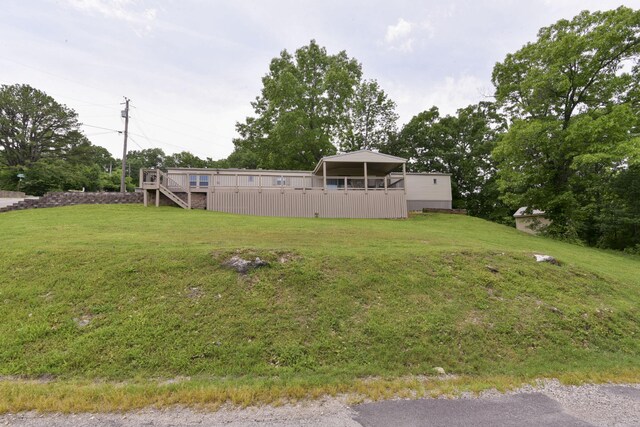 269 Moore Ln, Blue Eye, MO 65611 - view of green lawn featuring stairway and a deck