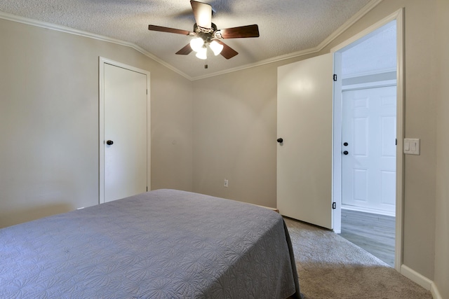 269 Moore Ln, Blue Eye, MO 65611 - carpeted bedroom featuring crown molding, vaulted ceiling, baseboards, ceiling fan, and a textured ceiling
