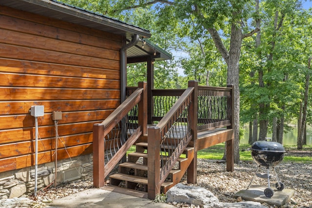 26 Cave Ln Unit 10, Indian Point, MO 65616 - wooden deck with stairway and grilling area